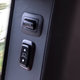Tacked on buttons for closing the rear doors, and moving the rear seat headrests